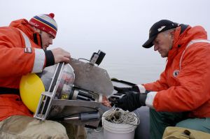 Michigan Tech president Glenn Mroz with ALWAS: Automated Lagrangian Water-Quality Assessment System